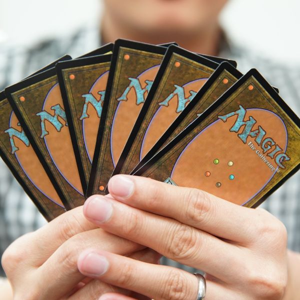 A player participates in a game of Houston Magic: The Gathering draft.