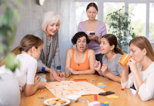 Texas Tabletop Games Group of Friends Playing Board Game on Table